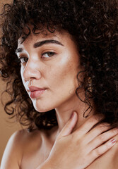 Wall Mural - skincare, hair care and face of a woman with makeup, beauty and natural glow against a brown studio 