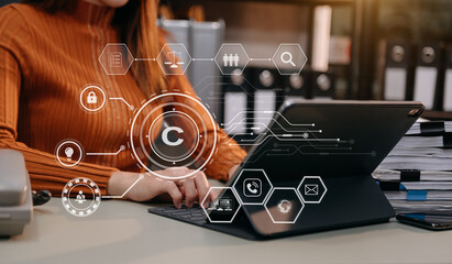 Wall Mural - Copyright or patent concept, Person hand using laptop computer, tablet and smartphone with virtual screen copyright icon trademark, Creation ownership against piracy.