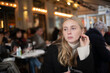 © FOLIO - Teenage girl sitting at cafe
