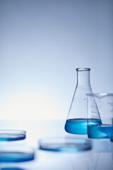 Sticker - laboratory flask with blue liquid