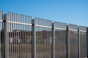 Borders: the fence with steel metal grate. Detail of the grate is made with a resistant and solid structure which increases the safety of the premises