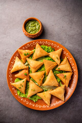 Wall Mural - cocktail mini triangle samosa made using patti or strip, popular home made snack from India