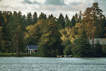recreation center on the lake shore in the forest. a great place for fishing in summer. forest lake.