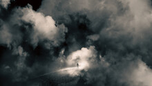 A Mystical Concept Of A Man On A Road Floating In The Sky. Looking At The Bright Light Of Heaven Surrounded By Clouds.