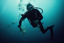 A Man With A Scuba Diver At The Bottom Of The Ocean Underwater View