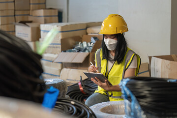 Working at warehouse. Male warehouse worker checking in storage department. Employee organizing goods distribution to the market.