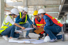 Team Of Civil Engineer Manager, Maintenance Supervisor, Professional Technician Foreman Together With Safety Operator Inspect And Discuss The Infrastructure Of Building Construction Progress At Site