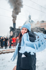 Canvas Print - smiling woman portrait at railway station near old retro steam train