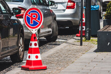 Parking Reservation Cone Or No Parking Next To A Couple Of Parked Cars
