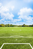 White lines of a soccer field against soft green grass