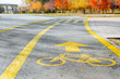 © Sergio - Drawn yellow bicycle sign on an asphalt road in an autumn park. Dedicated bike path