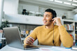 © Kateryna - Joyful young adult freelancer man in headset having a conversation online. Attractive employee on video business meeting, communicate with coworkers by internet, smiling