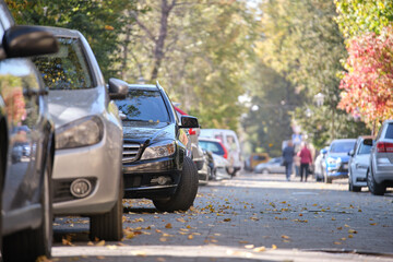 Sticker - City traffic with many cars parked in line on street side