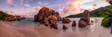 Sunset Panorama Of A Tropical Beach With Granite Rocks