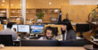 © Caia Image - Business people talking, working at computer in office