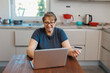 © SOLOTU - Mature woman using credit card making online payment at home. Successful old woman doing online shopping using laptop. Closeup of retired lady holding debit card for internet banking