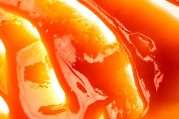 Red sauce splashes as background.