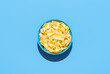 Pappardelle pasta bowl isolated on a blue background