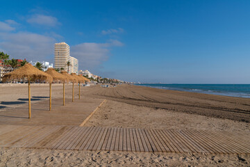 Sticker - Sunshade parasols on Peniscola sandy beach Costa del Azahar tourist destination Spain