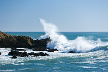 Ocean Waves Break Against Rocky Outcrops Along The Central Coast Of California
