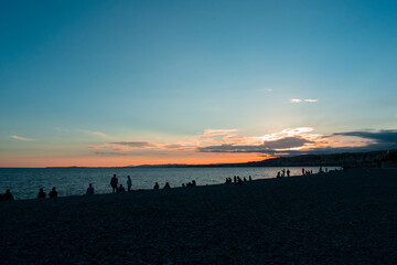 Wall Mural - Beautiful colourful sunset over beach and sea in Nice, France  