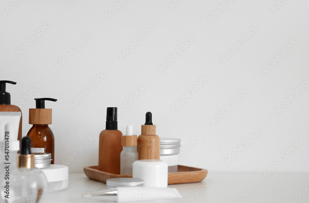 Set of different cosmetic products on light background