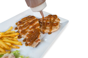 Wall Mural - Top view of pork steak with french fried and Kraft in white plate, focus selective