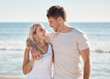 © D Theron/peopleimages.com - Happy, love and smile with couple at beach for relax, travel and summer by the sea. Freedom, support and hug with man and woman on date vacation together for bonding, affection and ocean holiday