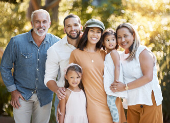 Big family, portrait and happy smile, love and support together outdoor in nature parking with care, trust and bond. Girl kids, mother and father bonding with grandparents with happiness in Amsterdam