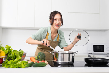 Portrait of a housewife in the kitchen at home