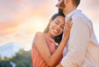 © L Ismail/peopleimages.com - Couple, smile and hug for love, support or care for relationship bonding or embrace together in the outdoors. Happy woman hugging man embracing romance and smiling in happiness for fun quality time