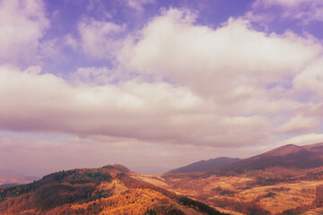 Wall Mural - Silhouette of mountains in the early misty morning. View of the mountains in autumn. Beautiful nature landscape. Carpathian mountains. Ukraine