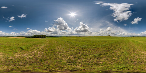 Wall Mural - full seamless 360 hdri panorama view among farming field with sun and clouds in overcast sky in equi