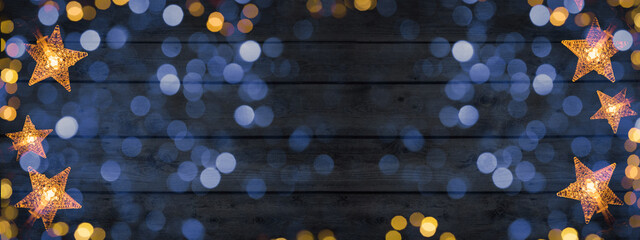 christmass celebration decoration background banner - frame made of golden star light chain and boke
