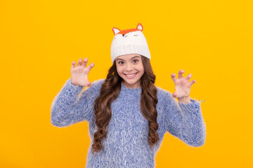 Sticker - happy kid long hair in knitted hat on yellow background, winter clothing