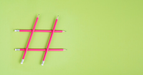 Hashtag made from pencils, social media communication, influencer and followers, viral content trend
