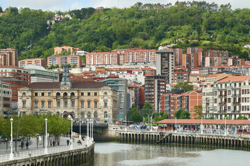 Wall Mural - View of the nervion river and the city hall of Bilbao, Biscay, Basque Country, Euskadi, Spain