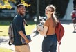 © Allistair F/peopleimages.com - Friends, students or college couple walking with books and backpack on campus for education, learning and scholarship. Portrait of interracial man and woman at university or school to study and learn
