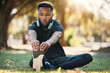 © Allistair F/peopleimages.com - Health, black man and stretching outdoor for exercise, fitness or wellness with breathing and focus. Healthy male, athlete or training for workout, balance or endurance for cardio, stamina on grass