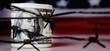US Dollar money wrapped in barbed wire on United States national flag background as symbol of economic warfare, sanctions and embargo busting