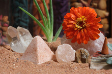 Chakra Stones With Aloe Vera Plant And Incense Cone On Australian Red Sand