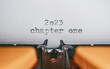 Leinwandbild Motiv Old Typewriter with following text on paper - 2023 Chapter one. new years concept