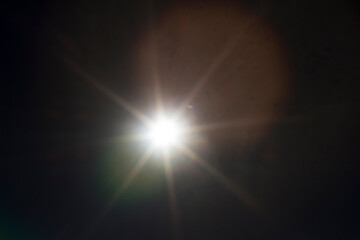Wall Mural - pin light with star shape on a dark background for a perfect overlay to enhance skies or nightscape 