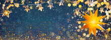Yellow Shining Star And Christmas Garlands On A Blue Abstract Background With Bokeh And Snowflakes