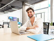 © ADDICTIVE STOCK - Focused man working on laptop in coworking space