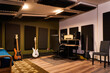 © ADDICTIVE STOCK - Interior of modern studio with guitars
