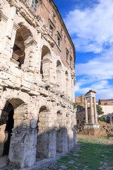 Wall Mural - The Theatre of Marcellus (Teatro Marcello)in Italy, the largest open-air theatre in Ancient Rome. On the right the ruins of Temple of Apollo Sosianus.