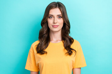 Sticker - Photo of nice positive gorgeous girl with wavy hairdo dressed yellow t-shirt look at camera isolated on turquoise color background