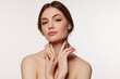 © master1305 - Portrait of young beautiful woman with perfect smooth skin isolated over white background. Facebuilding.
