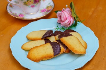 Poster - Tasty homemade chocolate dipped cookies served on the wooden table